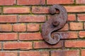 Rusted iron decoration on a brick wall located in the Queen Anne district of Seattle