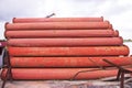 Rusted iron steel metal pipes stack an industrial field Royalty Free Stock Photo