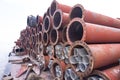 Rusted iron steel metal pipes stack an industrial field Royalty Free Stock Photo