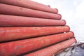 Rusted iron steel metal pipes stack an industrial field Royalty Free Stock Photo