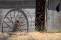 Rusted iron wheel in front of abandoned tool shed on Santa Cruz Island in the Channel Islands National Park near Santa Barbara