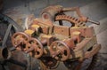 Rusted machinery detail in red tone. Grunge background. Royalty Free Stock Photo