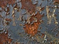 Rusted metal signboard with peeling paint and illegible inscription, close-up Royalty Free Stock Photo