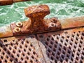 Rusted metal surface on old pier by ocean Royalty Free Stock Photo