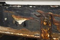 Rusted metal work on a boat hull