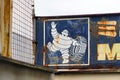 Rusted Michelin advertising sign at an abandoned workshop in Ashikaga, Japan