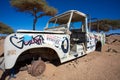 Rusted off road vehicle abandonned in the desert of Morocco