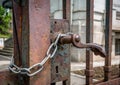 Rusted old gate/door locked with a chain Royalty Free Stock Photo