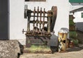 Rusted old machine by De San Clemente Maquinaria on display outside at Molino El Vinculo near Zhahara de la Sierra.