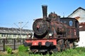 Rusted old steam locomotive in an open-air museum