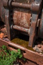 Rusted Piece of Mining Equipment and Weeds