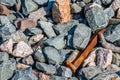 Rusted Railroad Spike in Loose Rock