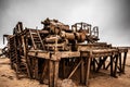 The rusted remains of an abandoned oil drilling rig between Henties Bay and Torra Bay, Skeleton Coast, Namibia. Royalty Free Stock Photo