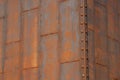 Rusted sheet metal panels forming a corner with rivets Royalty Free Stock Photo