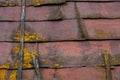 rusted sheet metal roof with wooden planks, mold and dirt