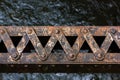 Rusted steel beam over water