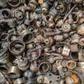 rusted steel scrap pile of used car parts and pieces