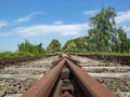 Rusted tracks of a disused railroad line lead to nowhere Royalty Free Stock Photo