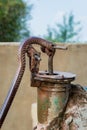 Rusted traditional old hand operated water pump at Egyptian rural village