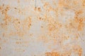 Rusted white painted metal wall. Rusty metal background with streaks of rust. Rust stains Royalty Free Stock Photo