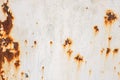 Rusted white painted metal wall. Rusty metal background with streaks of rust. Rust stains Royalty Free Stock Photo