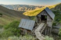 Adelmann mining shack in Idaho at the bottom of a canyon with wooden bridge Royalty Free Stock Photo