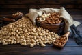 Rustic abundance Dried nuts in brown sacks on wooden background