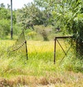 Rustic aged metal gate opening into t he paddy field, rural village landscape photograph Royalty Free Stock Photo