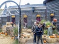 Rustic aged wooden huts surrounded by Halloween themed items