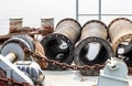 Rustic anchor machine and stored abandoned pipes on a dredging ship close up Royalty Free Stock Photo