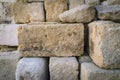 Rustic ancient handcrafted stack stone wall in Matera, italy