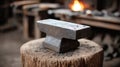 Rustic anvil in a blacksmith workshop with a glowing forge. Royalty Free Stock Photo