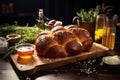 A rustic artisan Challah made with organic, natural ingredients. The bread is set on a wooden cutting board, surrounded by