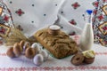 Rustic background: artisan bread, a bottle of milk, butter, salt and barley ears on ethnic background Royalty Free Stock Photo