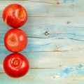 Rustic background three red apples