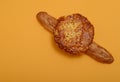 Rustic baguette and flapjack on orange background