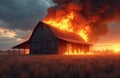 Rustic barn engulfed in flames at sunset. Thick smoke billows into the dramatic sky. Dry grass field surrounds burning structure. Royalty Free Stock Photo