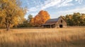 Rustic Barn with Fall Foliage and Golden Grass Field Royalty Free Stock Photo
