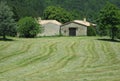 Rustic barn with mown meadow Royalty Free Stock Photo