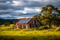 Rustic barn with solar panels in a scenic countryside landscape Royalty Free Stock Photo