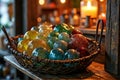 Rustic basket of colorful glass orbs illuminated by warm candlelight indoors Royalty Free Stock Photo