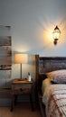 A rustic bedroom with a bed, a nightstand, and a lamp illustration Artificial Intelligence artwork generated