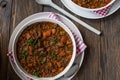 Rustic beef lentil stew on wooden table Royalty Free Stock Photo