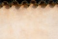 Rustic beige wall background with old tiles on top Royalty Free Stock Photo