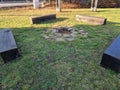 rustic bench made of halved debarked logs with legs made of logs. Royalty Free Stock Photo