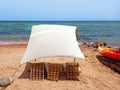 Rustic Berber chill out on the Red Sea coast in the Sinai Peninsula. Rustic canvas on the beach of Dahab. Awning and tent in the Royalty Free Stock Photo