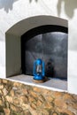 Rustic blue lantern in an exterior window, stucco and stone walls, Arusha, Tanzania Royalty Free Stock Photo