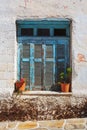 Rustic blue window in Halki, Naxos Island, Greece. Royalty Free Stock Photo