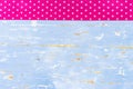 Old light blue wooden background with pink star shape pattern fabric border Royalty Free Stock Photo