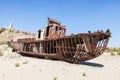 Rustic boats on a ship graveyards on a desert around Moynaq, Muynak or Moynoq - Aral sea or Aral lake - Uzbekistan in Central Asia Royalty Free Stock Photo